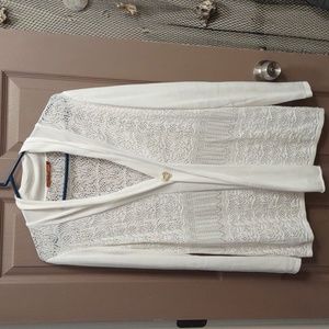 This beautiful lace topper will really accentuate any blouse or outfit.